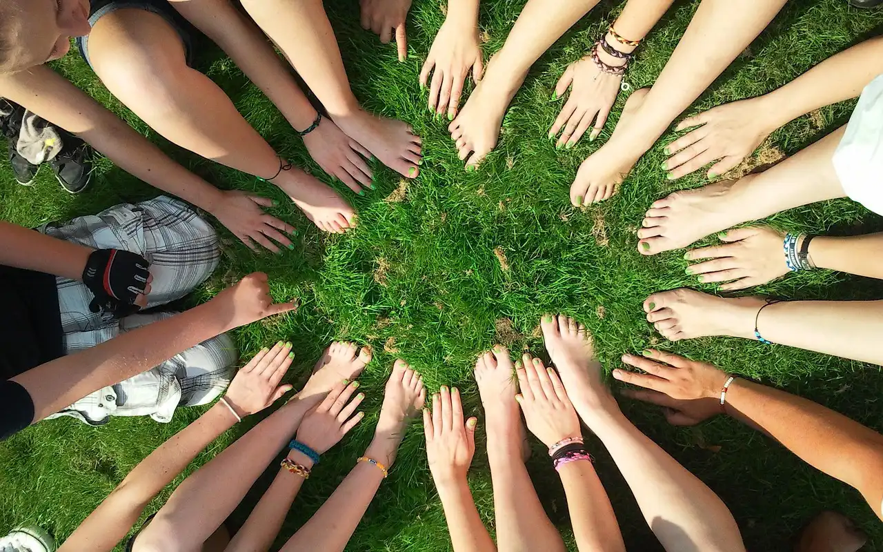 SEveral hands in a ring.